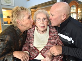 The newest centenarian born January 21, 1917, Jean Jamieson celebrates her 100th birthday with family about to get kisses on her cheek by daughter Lois Rogers and son David Jamieson at the Laurier House Lynnwood a nursing care centre in Edmonton, Wednesday, January 25, 2017. Ed Kaiser/Postmedia