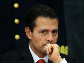 Mexico's President Enrique Pena Nieto pauses during a press conference at Los Pinos presidential residence in Mexico City, Monday, Jan. 23, 2017. Pena Nieto said Monday that Mexico's attitude towards the Donald Trump administration should not be aggressive or biased, but one of dialogue. (AP Photo/Marco Ugarte)
