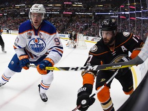 Edmonton Oilers center Connor McDavid, left, and Anaheim Ducks center Ryan Kesler battle during the first period of an NHL hockey game, Wednesday, Jan. 25, 2017, in Anaheim, Calif.