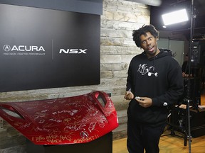Director Flying Lotus of 'Kuso' signs the hood of a 2017 Acura NSX in the Acura Studio during Sundance Film Festival 2017 on January 23, 2017 in Park City, Utah. (Photo by Neilson Barnard/Getty Images for Acura)