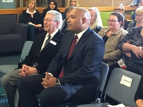 John Laporta, chief executive of the Thames Valley Children?s Centre, sits with Ontario Children and Youth Services Minister Michael Coteau during a funding announcement Thursday at the centre. Coteau announced $400,000 in provincial funding for repairs and upgrades for the centre. (MORRIS LAMONT, The London Free Press)