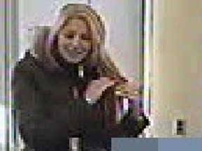 Kingston Police are searching for this suspect after a Calgarian's bank account was defrauded of more than $12,500 in Kingston, Ont. on Friday, December 9, 2016. Photo supplied by Kingston Police