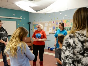 Noel Cairney teaches participants of her LOL 101 session the benefits of laughter — even if it means laughing to simply enjoy being happy. She is holding a weekly class at the Stony Plain Public Library. - Photo by Marcia Love