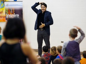 Prime Minister Justin Trudeau plays Simon Says with students at Robert H. Smith School in Winnipeg, Thursday, January 26, 2017. Trudeau spent the day in Winnipeg as part of his cross-country tour. THE CANADIAN PRESS/John Woods