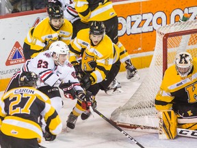 Kingston Frontenacs players surround Niagara IceDogs’ Johnny Corniel (23) during OHL action Dec. 31 at the Meridian Centre in St. Catharines. (Bob Tymczyszyn/Postmedia Network)