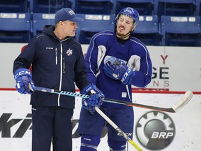 Sudbury Wolves  assistant coach Barry Smith chats with defence man Zach Wilkie during team practice in Sudbury, Ont. on Thursday January 26, 2017. Gino Donato/Sudbury Star/Postmedia Network