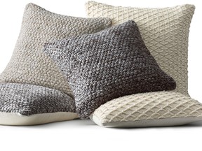 Soft wools, like these Ben Soleimani pillow covers from Restoration Hardware?s new collection, are part of the hygge vibe. (Restoration Hardware/The Associated Press)