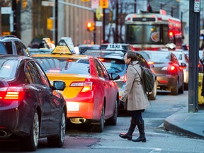 Pedestrians and traffic along King St. W. at University Ave. in Toronto, Ont. on Thursday, January 26, 2017. (Ernest Doroszuk/Toronto Sun)