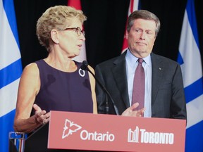 Premier Kathleen Wynne and Mayor John Tory hold a joint press conference at Queen's Park in Toronto. (Veronica Henri/Toronto Sun files)