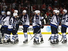 The Jets celebrate their victory over the Blackhawks. (Jonathan Daniel/Getty Images)