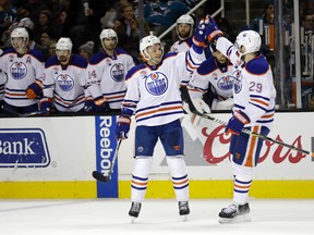 Edmonton Oilers' Andrej Sekera, front left, celebrates his goal with teammate Leon Draisaitl against the San Jose Sharks on Thursday, Jan. 26, 2017, in San Jose, Calif. (AP Photo/Marcio Jose Sanchez)