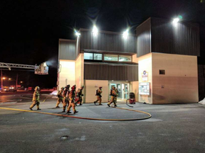 Firefighters work on a blaze at the Manotick Arena Friday morning.