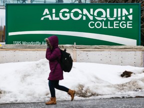 A student walks on the Woodroffe campus of Algonquin College in Ottawa