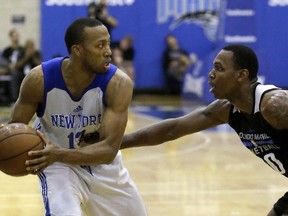 A Wednesday, July 6, 2016 file photo of New York Knicks' Akil Mitchell (left), as he looks to pass the ball around Orlando Magic White's Treveon Graham during the first half of an NBA summer league basketball game in Orlando, Fla. Mitchell's eye popped out of its socket after he was poked in the face while going for a rebound during a game in New Zealand on Thursday, Jan. 26, 2017. (AP/PHOTO)
