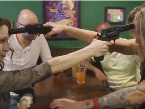 Patrons take part in a Russian roulette stun gun game at a San Francisco bar in this image from a YouTube video. (Handout/Postmedia Network)