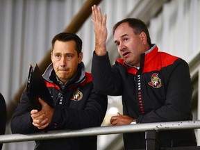 Senators coach Guy Boucher (left) and GM Pierre Dorion. (The Canadian Press)