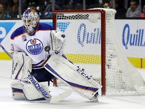 Edmonton Oilers goalie Cam Talbot stops a shot during the first period of the team's NHL hockey game against the San Jose Sharks Thursday, Jan. 26, 2017, in San Jose, Calif.