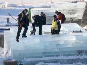 One warming hut at The Forks, surrounded by caution tape and GoPro cameras, is seen being made out of ice blocks Friday, January 27, 2017. (Winnipeg Sun/Postmedia Network)