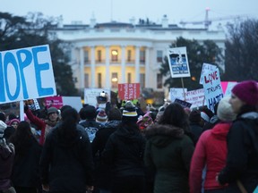 Protesters gather outside the White House at the finish of the Women's March on Washington on January 21, 2017 in Washington, D.C. Large crowds attended the anti-Trump rally a day after U.S. President Donald Trump was sworn in as the 45th U.S. president. (Photo by Mario Tama/Getty Images)