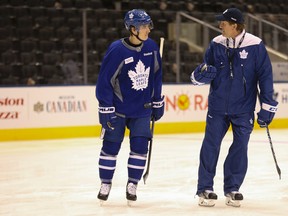 Toronto Maple Leafs coach Mike Babcock talks with Mitch Marner in the pre-game skate before a game against the Calgary Flames in Toronto on Jan. 23, 2017. (Jack Boland/Toronto Sun/Postmedia Network)