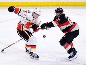 Senators captain Erik Karlsson (right) has averaged approximately 27 minutes of ice time in 44 games this season. (The Canadian Press)