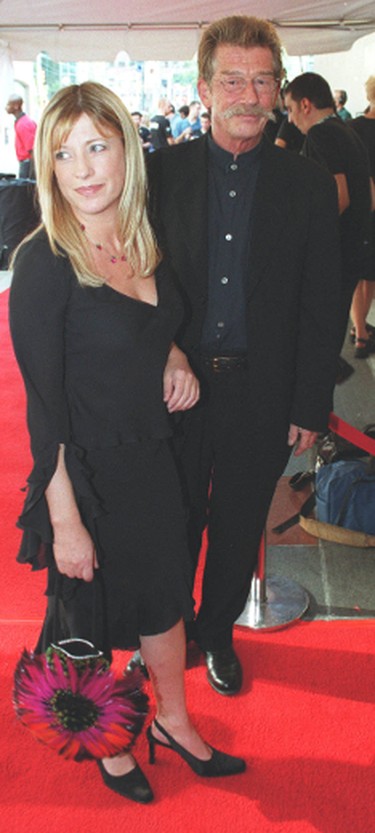 Actor John Hurt with friend Sarah Owens was one of many paying tribute to eclectic director Stephen Frears at the Toronto International Film Festival, Sept. 9, 2000. (Todd Gillis/Postmedia Network files)