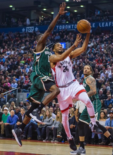 Toronto Raptors Norman Powell during 1st half action against Milwaukee Bucks Tony Snell at the Air Canada Centre in Toronto, Ont. on Friday January 27, 2017. Ernest Doroszuk/Toronto Sun/Postmedia Network