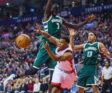 Toronto Raptors Kyle Lowry during 1st half action against Milwaukee Bucks Thon Maker (left) and Malcolm Brogdon at the Air Canada Centre in Toronto, Ont. on Friday January 27, 2017. Ernest Doroszuk/Toronto Sun/Postmedia Network