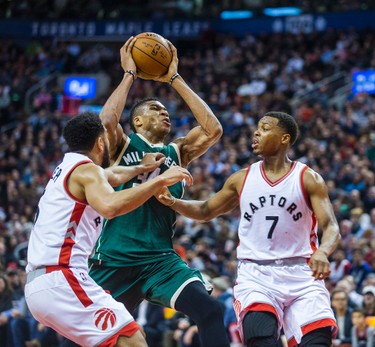 Toronto Raptors Cory Joseph (left) and Kyle Lowry during 2nd half action against Milwaukee Bucks Giannis Antetokounmpo at the Air Canada Centre in Toronto, Ont. on Friday January 27, 2017. Ernest Doroszuk/Toronto Sun/Postmedia Network