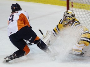 Flint Firebirds forward Jack Phibbs scores his first-career Ontario Hockey League goal on Sarnia Sting goalie Justin Fazio during the game at Progressive Auto Sales Arena on Friday, Jan. 27, 2017 in Sarnia, Ont. Fazio stopped the other 32 shots he faced for his 50th career victory. (Terry Bridge/Sarnia Observer)