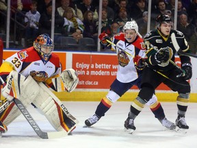 TJ Fergus of the Erie Otters ties up Mitchell Stephens of the Knights in front of Troy Timpano in the first period of their game Friday night at Budweiser Gardens on Friday January 27, 2017. (MIKE HENSEN, The London Free Press)
