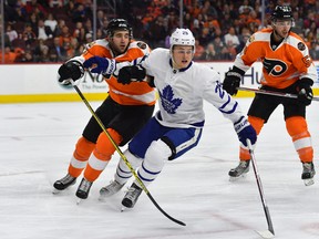 William Nylander (centre) became the fourth Leafs rookie to hit the double-digit mark in goals this season when he scored against the Flyers on Thursday night in Philadelphia. (AP)