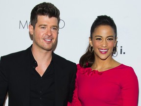 In this Wednesday, Oct. 23, 2013 file photo, Robin Thicke and Paula Patton attend the sixth annual GQ Gentlemen's Ball in New York. (Photo by Charles Sykes/Invision/AP, file)