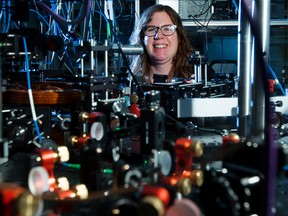 University of Alberta Assistant Professor of Physics Lindsay LeBlanc poses for a photo in the Ultracold Quantum Gas Lab, where she and her team have successfully created Bose-Einstein condensate — the coldest gas known to man, in Edmonton Friday Jan. 27, 2017. LeBlanc is photographed with the quantum gas apparatus that was used to create Bose-Einstein condensate. Photo by David Bloom