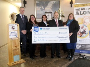 The Northern Credit Union donated $5,000 to the We Are Not Alone campaign on Jan. 26. Geoff Phillips, left, director of sales for the Northern Credit Union, Bev Winn, a branch manager of the Northern Credit Union, Sarah Gillingham, branch concierge of the Northern Credit Union, Kevin McCormick, Chair of NOCLD board of directors, and Mary-Liz Warwick, executive director of NOCLD, were on hand for the presentation. Supplied photo