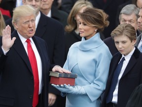 U.S. President Donald Trump takes the oath of office as his wife, Melania Trump, holds the bible and his son Barron Trump looks on, on the West Front of the U.S. Capitol on January 20, 2017 in Washington, D.C. (Chip Somodevilla/Getty Images)