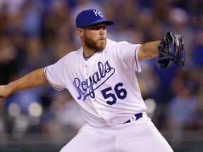 In this April 8, 2015, file photo, Kansas City Royals pitcher Greg Holland throws against the Chicago White Sox at Kauffman Stadium in Kansas City, Mo. (AP Photo/Orlin Wagner, File)