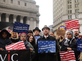 Muslims and local immigration activists participate in a prayer and rally against President Donald Trump's immigration policies on January 27, 2017 in New York City. Trump has taken actions to cut federal grants for immigrant protecting 'sanctuary cities.' (Spencer Platt/Getty Images)