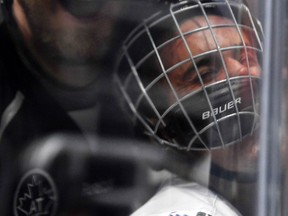 Singer Justin Bieber, who is playing for Team Gretzky, is pushed into the glass by Chris Pronger of Team Lemieux during the NHL All-Star Celebrity Shootout at Staples Center, Saturday, Jan. 28, 2017, in Los Angeles. (AP Photo/Mark J. Terrill)
