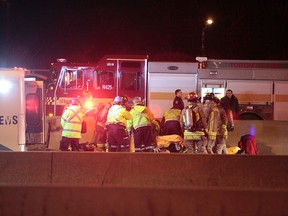 Emergency personnel are pictured at a crash in the westbound lanes of the Gardiner Expressway, near the South Kingsway ramp. (JOHN HANLEY PHOTO)