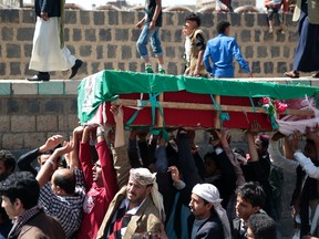 People carry a coffin of a man, who was killed in the recent Saudi-led airstrikes during his funeral, in the Old City of Sanaa, Yemen, Saturday, Jan. 28, 2017. (AP Photo/Hani Mohammed)