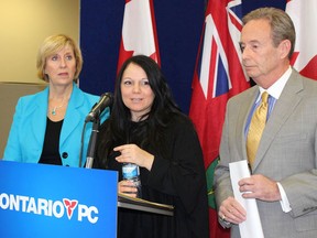 From left, Progressive Conservative MPP Laurie Scott, human trafficking survivor Timea Nagy, and Whitby-Oshawa byelection PC candidate Lorne Coe, call on the provincial Liberal government to adequately fund the fight against this modern form of human slavery. Nagy will be in Seaforth March 8 for a workshop explaining human trafficking.(Postmedia file photo)