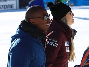 Lindsey Vonn walks with her boyfriend Kenan Smith after competing at the women's World Cup super-G event in Cortina d'Ampezzo, Italy, on Sunday, Jan. 29, 2017. (Alessandro Trovati/AP Photo)