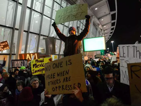 Protesters rally during a demonstration at John F. Kennedy International Airport.