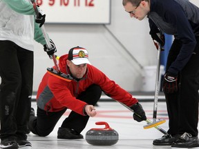 Skip Jon Beuk releases a shot as teammates Robert Currie, left, and Wes Forget look on during the semifinals of the 84th Whig-Standard Bonspiel at Royal Kingston Curling Club on Saturday. The Beuk rink defeated Noel Herron’s rink in an extra end to win the championship. (Steph Crosier/The Whig-Standard)