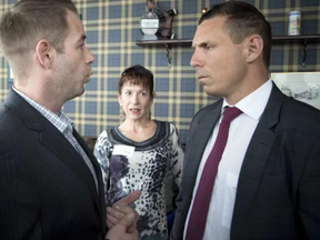 Jay Tysick, left, confronts Ontario Progressive Conservative Leader Patrick Brown during a town hall at The Glen Scottish Restaurant and Bar in Stittsville on Sunday January 29, 2017.