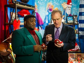 Dale The Deal Maker (left) and Coun. Norm Kelly chat at a Skittles holiday pop-up shop on Monday, Dec. 26, 2016. Kelly has launched a T-shirt with the slogan, “I’m moving to Canada” on it. (TORONTO SUN FILES)