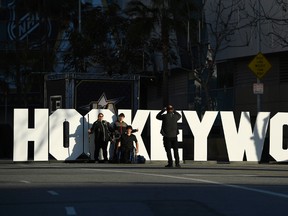 Fans pose in front of a "Hockeywood" sign at Staples Center in Los Angeles on Friday, Jan. 27, 2017. (Mark J. Terrill/AP Photo)