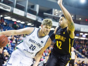 Russ Conley of the Niagara River Lions runs the ball past Julian Boyd of the London Lightning in basketball action at the Meridian Centre in downtown St. Catharines on Sunday, January 29, 2017. Julie Jocsak/ St. Catharines Standard/ Postmedia Network