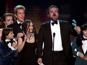 Winona Ryder and David Harbour of 'Stranger Things' accept the Outstanding Performance by an Ensemble in a Drama Series onstage during The 23rd Annual Screen Actors Guild Awards at The Shrine Auditorium on January 29, 2017 in Los Angeles, California. 26592_014 (Photo by Kevin Winter/Getty Images )